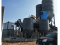 Continuous central mixing plant for road construction equipment 